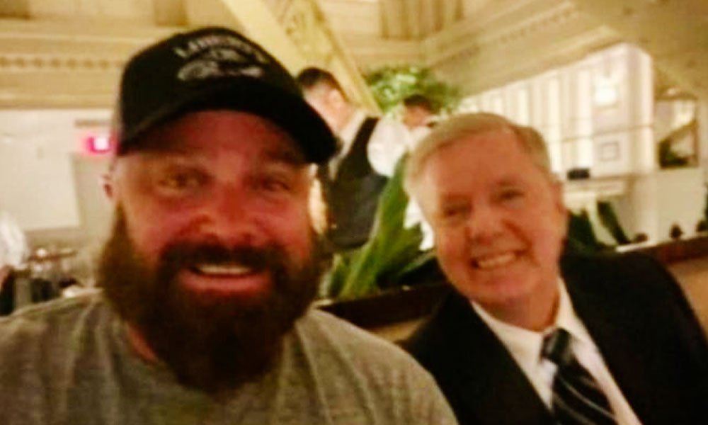 Joe Biggs, member of white nationalist group Proud Boys, during a dinner with Sen. Lindsey Graham (R-SC) at Trump hotel weeks before the Jan 6 attack on the US Capitol.