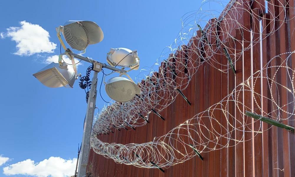razor-wire fence at the US-Mexico border.