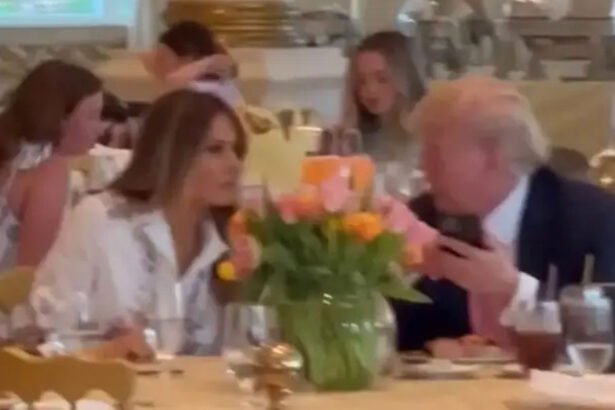 Donald Trump speaks with his wife, Melania Trump at Mar-a-Lago