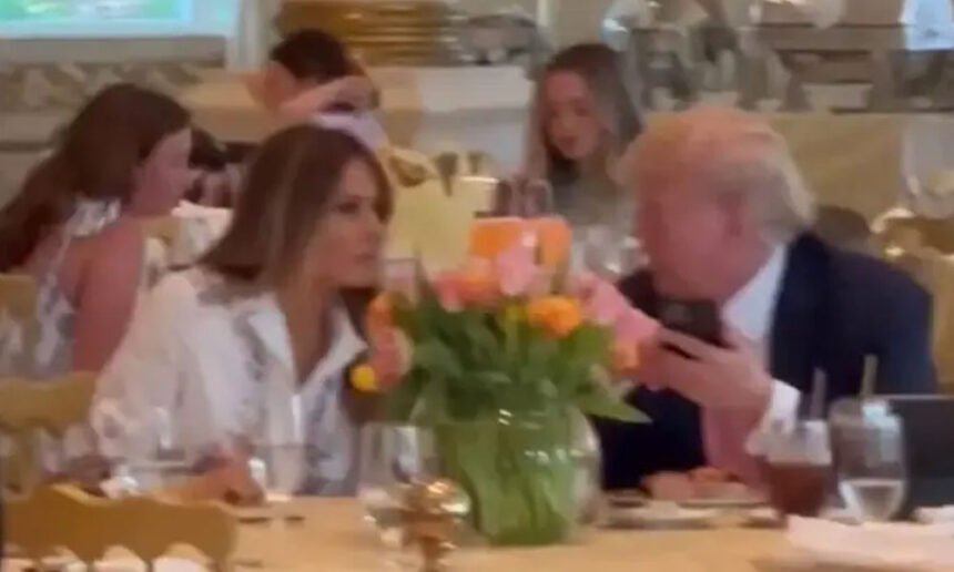 Donald Trump speaks with his wife, Melania Trump at Mar-a-Lago