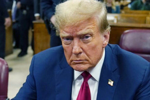 Former President Donald Trump sits at a Manhattan courthouse