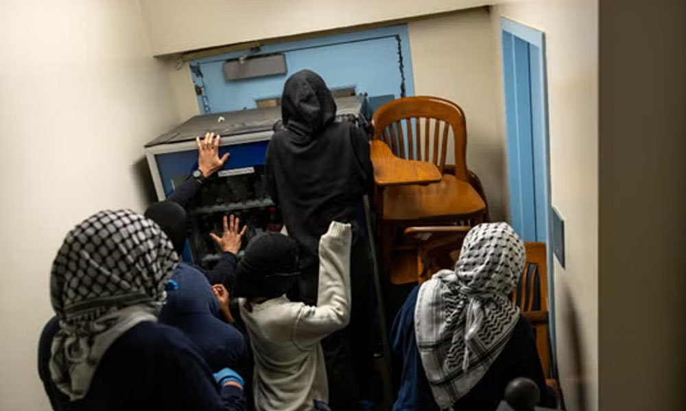 Demonstrators supporting Palestinians in Gaza barricade themselves inside Hamilton Hall 