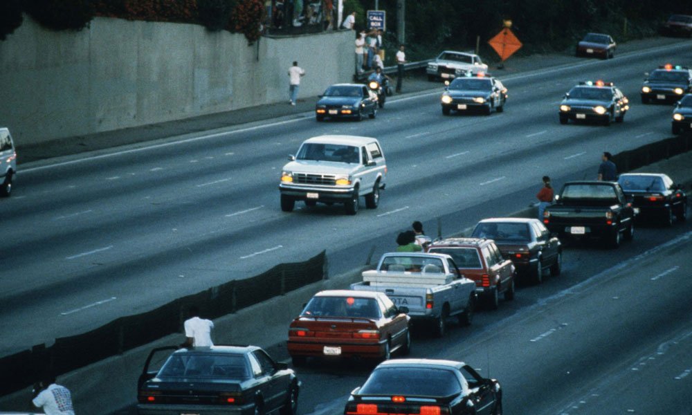 A white Ford Bronco driven by Al Cowlings and carrying O.J. Simpson is trailed by Los Angeles police cars as it travels on a freeway in Los Angeles on June 17, 1994
