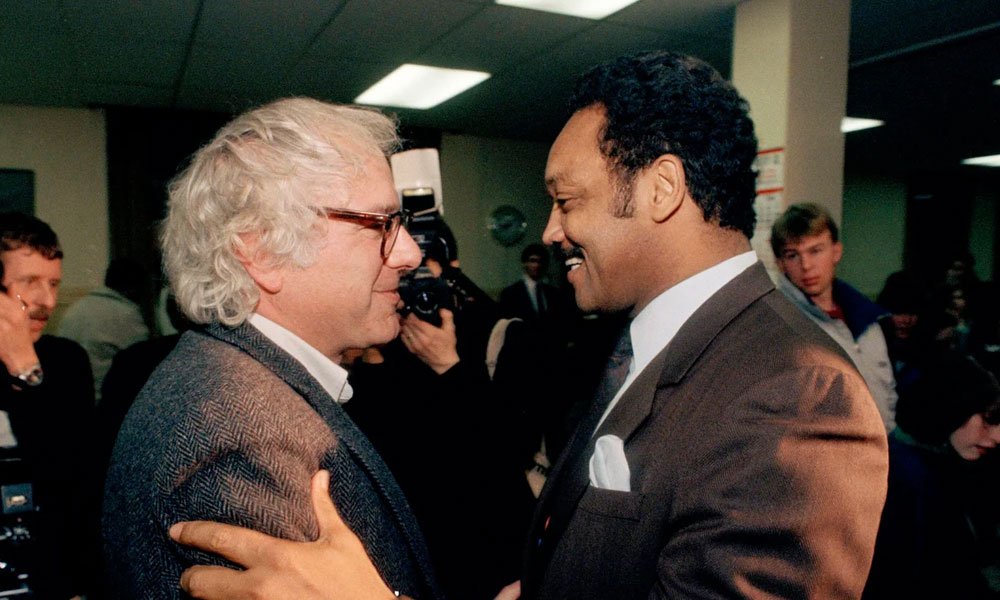 Jackson embraces Bernie Sanders.