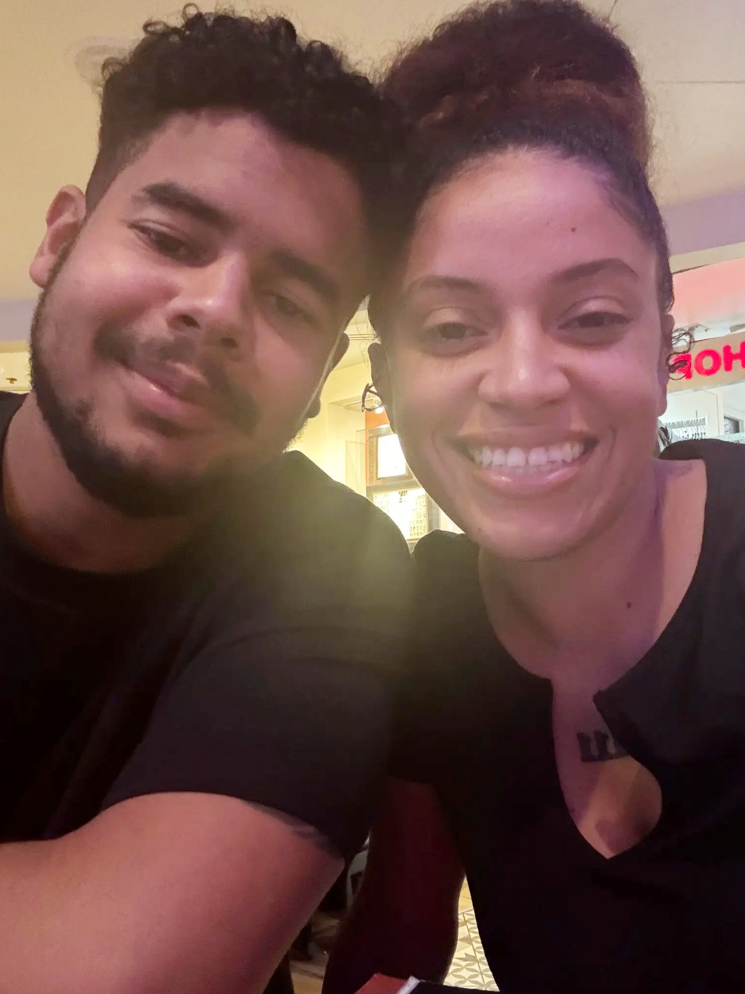 Sgt. Michael Emmanuel Swinton and Jamiah Swinton, smiling. 